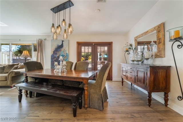 dining room featuring french doors and hardwood / wood-style floors