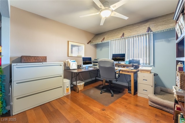 home office featuring ceiling fan and hardwood / wood-style flooring