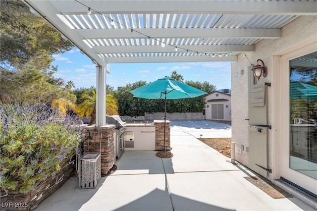 view of patio with a pergola and exterior kitchen