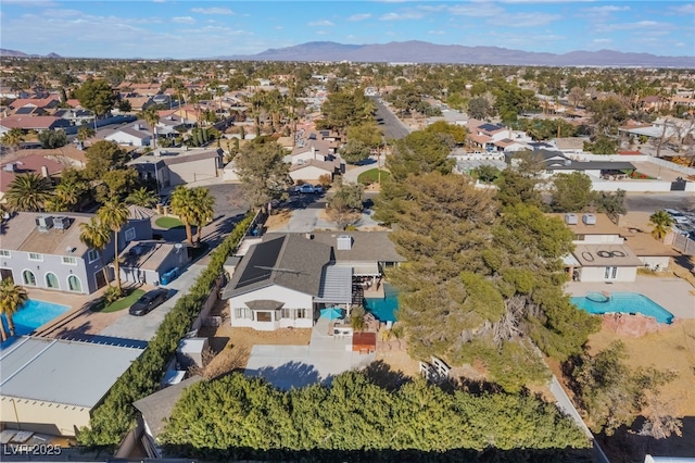 birds eye view of property with a mountain view