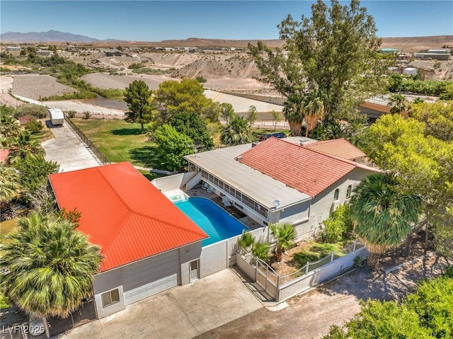 birds eye view of property with a mountain view