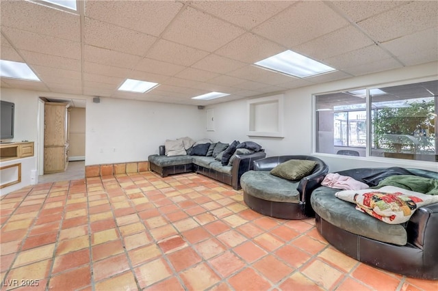 living room featuring a drop ceiling