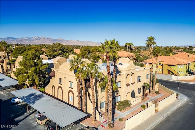 birds eye view of property featuring a mountain view