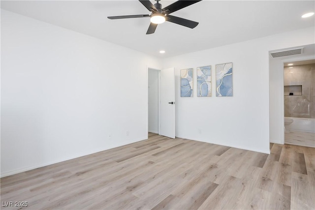 spare room with ceiling fan and light hardwood / wood-style floors