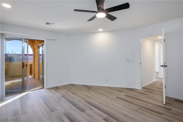 empty room featuring light hardwood / wood-style floors and ceiling fan