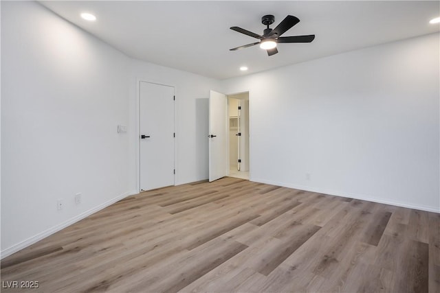 unfurnished room featuring light wood-type flooring and ceiling fan