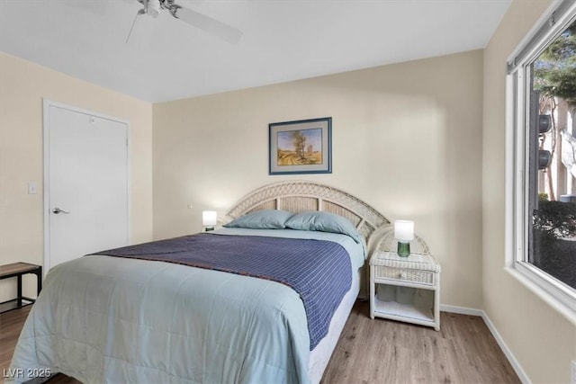 bedroom featuring ceiling fan and light wood-type flooring