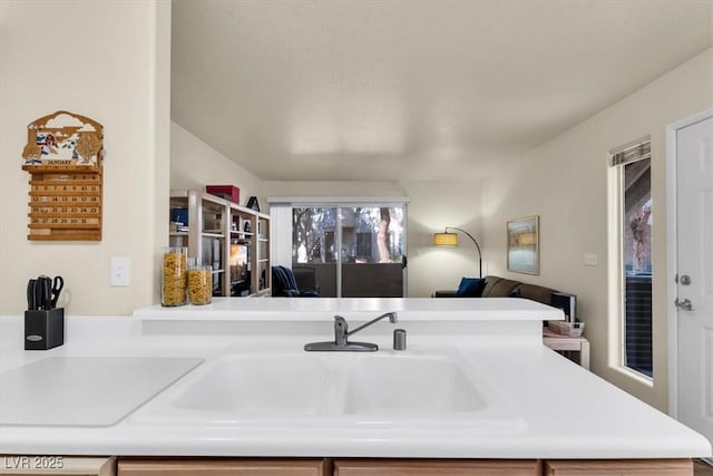 interior space featuring sink and kitchen peninsula