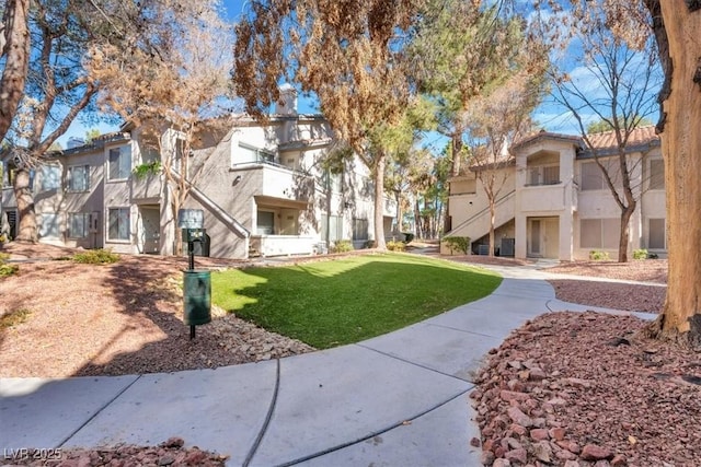 view of property's community with a yard