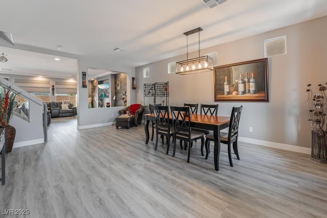 dining room with light hardwood / wood-style floors