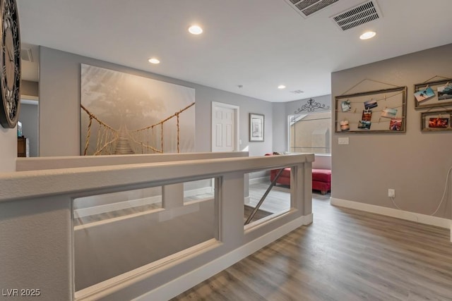 hallway with wood-type flooring