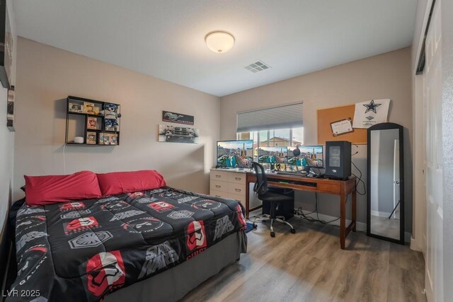 bedroom featuring hardwood / wood-style floors