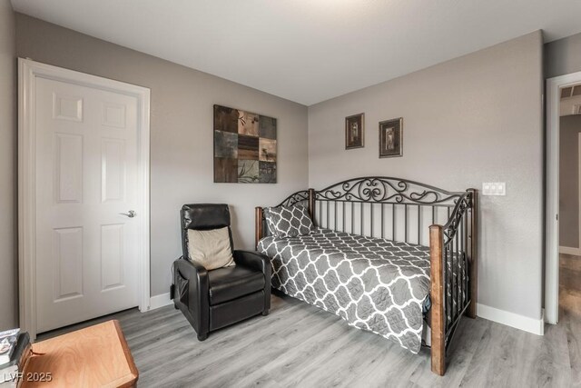 bedroom with hardwood / wood-style floors