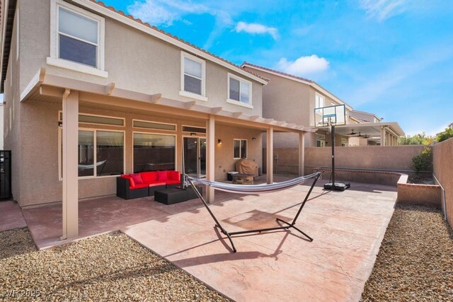 back of house with a patio area and an outdoor hangout area