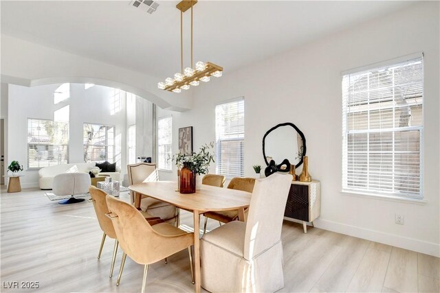 dining space featuring light wood-type flooring