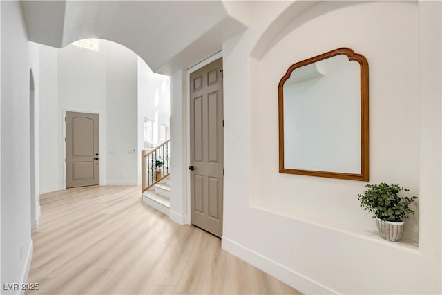 corridor with light wood-type flooring