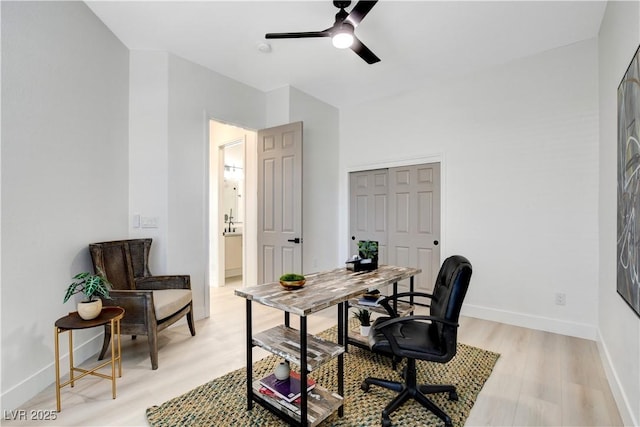 office area featuring light hardwood / wood-style floors and ceiling fan