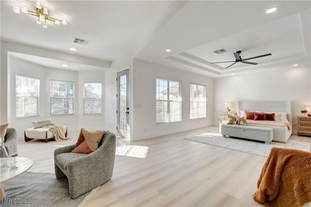 living room with ceiling fan and light wood-type flooring