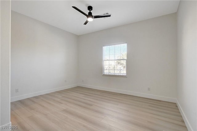 empty room featuring ceiling fan and light hardwood / wood-style flooring