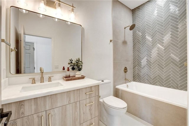 full bathroom featuring toilet, vanity, and tiled shower / bath combo