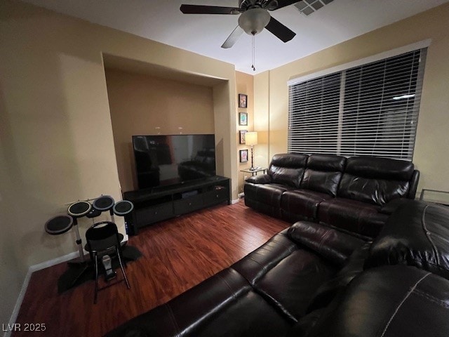 living room featuring ceiling fan and hardwood / wood-style flooring