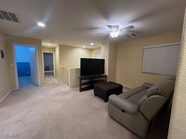 carpeted living room with ceiling fan