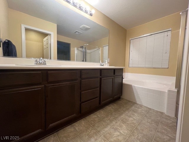 bathroom featuring separate shower and tub and vanity