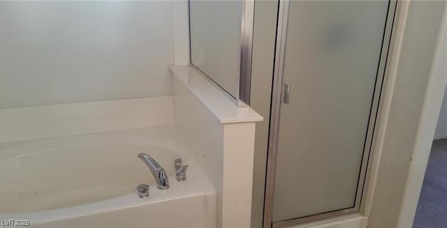 bathroom with separate shower and tub