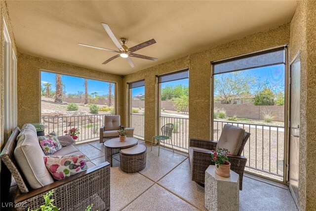 sunroom with ceiling fan