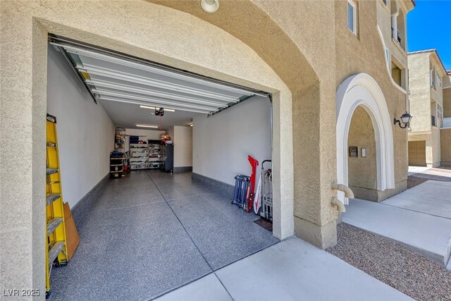 garage featuring a garage door opener