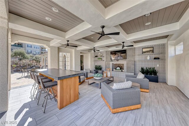 gym with a high ceiling, carpet floors, and ceiling fan