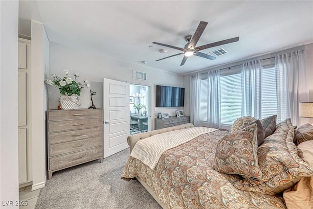 carpeted bedroom featuring ceiling fan