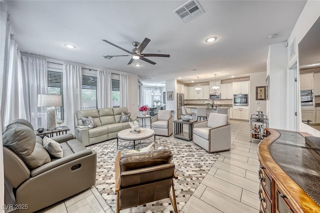 living room featuring ceiling fan