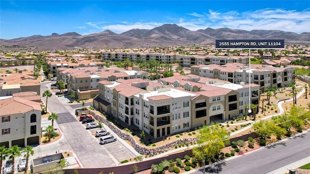 birds eye view of property featuring a mountain view