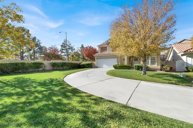 view of front of house featuring a front yard and a garage