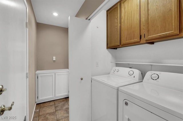 washroom with separate washer and dryer and cabinets