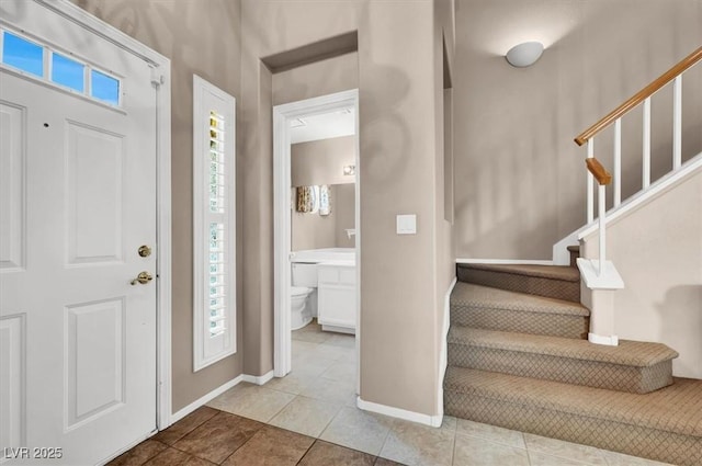 entrance foyer featuring light tile patterned floors