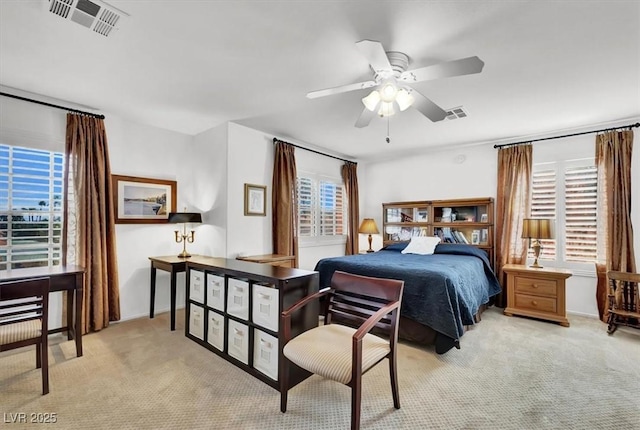 bedroom featuring ceiling fan and light colored carpet