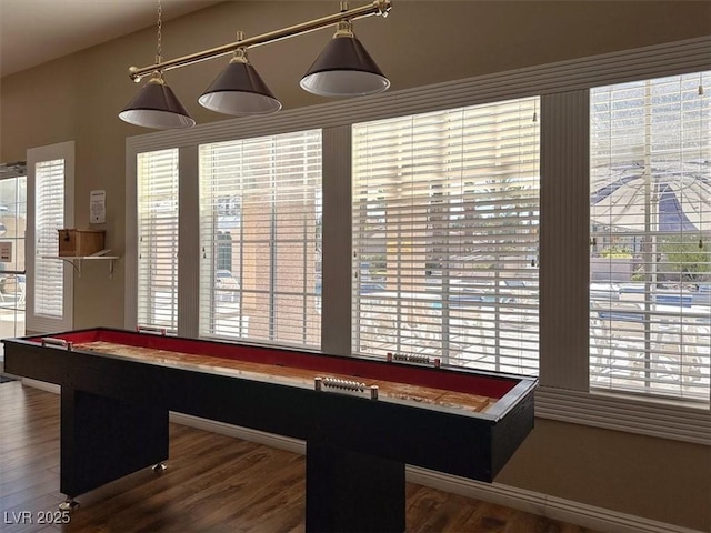 game room featuring dark hardwood / wood-style flooring, billiards, and a healthy amount of sunlight