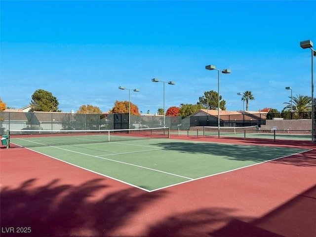 view of tennis court featuring basketball court