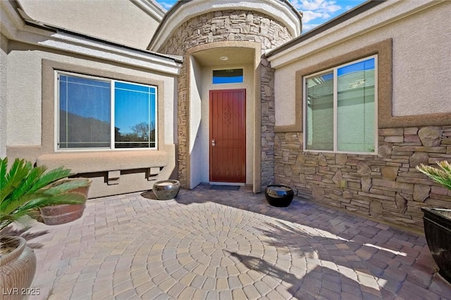 doorway to property featuring a patio