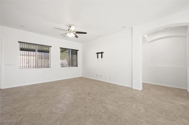 spare room with ceiling fan