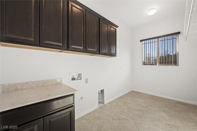 laundry area with hookup for an electric dryer, light tile patterned floors, hookup for a washing machine, cabinets, and gas dryer hookup