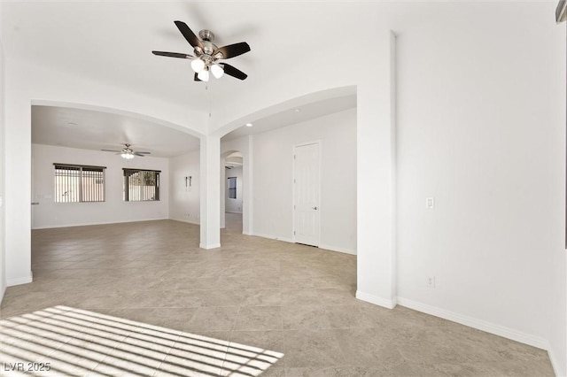 tiled empty room with ceiling fan