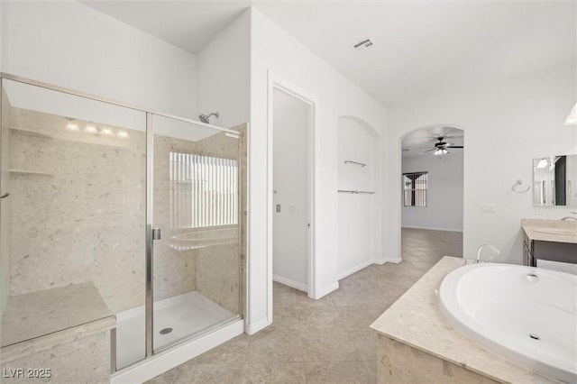 bathroom featuring vanity, tile patterned floors, ceiling fan, and independent shower and bath