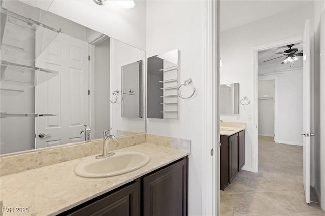 bathroom featuring ceiling fan, tile patterned floors, and vanity