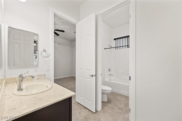 full bathroom featuring ceiling fan,  shower combination, vanity, and toilet