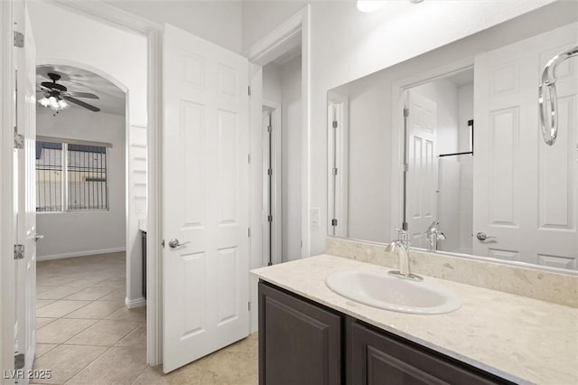 bathroom featuring vanity, tile patterned flooring, and ceiling fan