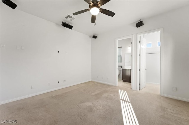 unfurnished living room with ceiling fan and light carpet