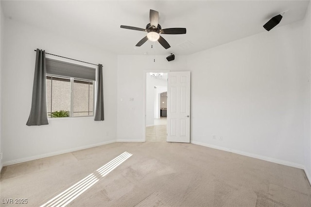 carpeted empty room with ceiling fan